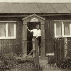 56 Blue House, Crimdon.One of the huts that were in Crimdon Dene in the early 30s, the notice on the side of the hut tells you when the well water was available.Photograph and caption from Bob Williams