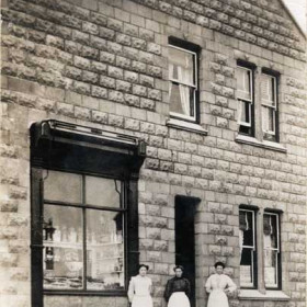 Miller's cake shop Cotsford Lane, Mrs Miller and daughters at the door c1918