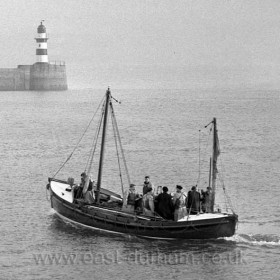 The Howard D sails out from Seaham Harbour.  The Howard D, a reserve boat was stationed at Seaham for a few weeks until a  permament craft arrived, it was  brought down from Scotland by 76 year old V M Wyndham Quinn, R N deputy chairman of the management committee of the R.N.L.I.