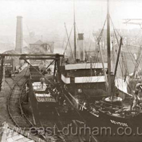 Londonderry steamship "Newton" unloading pit props in the North Dock around 1900. Lifeboat house built 1870 in left foreground.