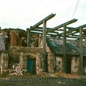 The old Dock Bethel (multi-denominational chapel) at right, cookhouse at centre below lighthouse cliff.