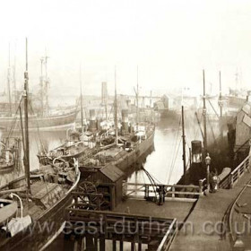 South side of north dock in 1904 at least three Londonderry steamers in dock.Old bucket dredger built by George Hardy in 1876 at centre left.