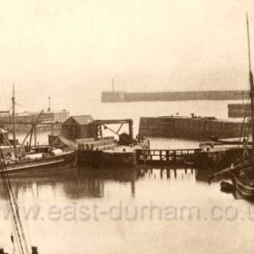 South western corner of the North Dock showing dock gates and collier under coal drop around 1908