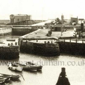 Entrance to the North Dock in the 1960s, lifeboat house at top left, South Dock to right.