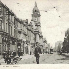 An undated card but the photograph would be taken during the first decade of the 20th Century. This is a good example of the typical method of deliverv of goods throughout the town at that time. This did not only apply within the town centre. Around 1910 my father delivered goods in this fashion for Fairmans the chemists in Vine Place. This entailed pushing a handcart to places like Ashbrooke and The Cedars, probably to doctors premises. The various delivery lads used to gather at the foot of the Barley Mow bank on Ryhope Road and then help to push one anothers cart; one at a time up the steep hill.