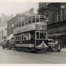 Fawcett Street in the 1950s. The Electricity Supply shop stands in the place of the Athenaeum as shown in a previous photograph.
The tramcar; No 15, started life as an 'open-top' in 1900, had its bogie replaced in 1901, was rebuilt between 1920 and 1922 to become a totally enclosed tram and then again rebuilt in 1934. It can be seen that one of the lower deck quarter lights was replaced with a side destination indicator. The tram was finally withdrawn from service early in 1953.