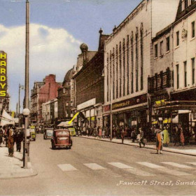 Fawcett Street in the 1950s. Very few motor cars are in evidence and the tramcars are still running so it must have been prior to 1954. The Gaumont Cinema on the right, previously the Havelock, stands where the great fire had occurred over fifty years ago. Shares furniture shop,behind the Gaumont, was also destroyed by arsonists in the 1960s. A further fire in the 1960s would also burn down Hardys furniture store.