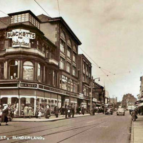 An undated postcard but most likely around the mid 1950s. The tramlines and overhead wires are still in existence but the absence of tramcars would date it after 1954.
A nice photograph of Blacketts departmental store, famous for its Santa's Grotto every Christmas. Immediately opposite is the single storey building of The British Home Stores which was later redeveloped. Next door to BHS is one of the many Lockharts cafes which were located in various parts of the town.