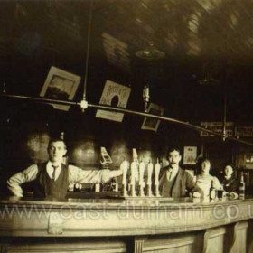 This is possibly a photograph of the interior of the Forester's Arms at 10 North Railway Street.
The man right of centre is John George Brown who ran the pub around 1910, he also ran a couple of pubs in Sunderland.
The Forester's Arms was a James Deuchar pub and the sign at centre is for Ross & Co Pale Ale, the Ross & Co brewery was owned by James Deuchar.
The Forester's did not close until around 1959 so there will be many people around who had a pint or two there.
Do you remember this bar, is it the Forester's?
Photograph from Joyce Malarkey, granddaughter of John George Brown