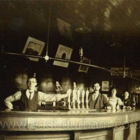 The Forester's Arms, opened 1844 at 10 North Railway St.
It was closed and demolished in 1959 during Snowdon and Bailes expansion.
John George Brown, landlord c1904 is second from left.
This is probably a photograph of the bar, do you have a photograph of the pub?
Did you ever have a beer in this bar, do you recognise it?
Photograph from Joyce Malarkey