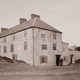 The Mill Inn before being demolished and rebuilt in 1892. Adjoining the pub is a butcher's shop and a dwelling houses. The Mill (windmill) is the 2nd building from the extreme right.