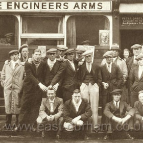 The ENGINEER’S ARMS, 1864 to present day, 6 South Tce.
Extreme left Peter Morris, 1st left front row Mr Mason, left in doorway Ena Gartland, centre Mr Whitelock and  right Peter Gartland.
Extreme right, 3rd row from front John Dunn