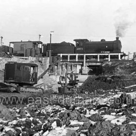 Cutting the underpass through to York House and Tempest Rd.  
The area to the left of the crane now level and grassed was originally part of the Dene and this deep hole became the town rubbish dump in the late 1940s, early 50s.