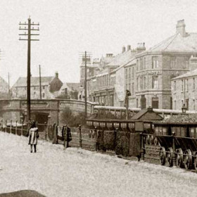 Detail from previous photograph.     .
Looking west from South Railway St to North Railway St and Castlereagh Rd.
From right to left, 34, 35 and 36 North Railway St, Castlereagh Hotel, Co-op, Drill Hall, Dene House Farm, unknown building and at extreme left Vane House.