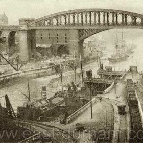 Bridges and  coal drops on the Wear.  c1910 ?
The main collieries supplying the Sunderland drops were in the Hetton area some five miles away. One line ran over Warden Law then far too steep for locomotives and several lengths of railway had to be cable hauled. It was a complex system developed by George Stephenson, attracting world wide attention and triggering off the world railway boom.
Information from Len Charlton.