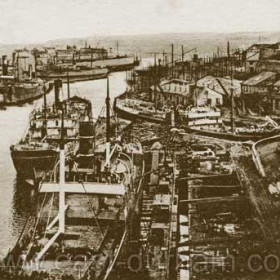 The River Wear before 1923. This photograph gives a good impression of how busy the shipyards were in the early 1900's.There are at least seven ships visible on this short stretch of the Wear below the bridge.,The three ships in the foreground, one raised on the pontoon are all in Austin's shipyard.
Information from Len Charlton.