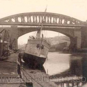 This photo dated 1919 shows the railway bridge built 1879 then downstream  the road bridge built by Robert Stephenson in 1859. This was the second cast iron road bridge, the first having been built in 1793.  
Information from Len Charlton.