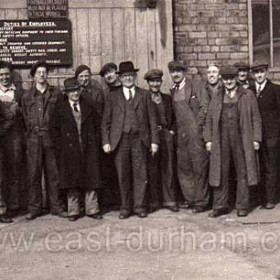 Outside the joiners shop of JL Thompson's Shipyard around 1945 / 48.    
From the left Morris Eastern,  Alf Redford ,  Ray Hunter, Geordie Fenwick (SHIP FOREMAN) , not known,  Billy Boyd,  Ernie Riddle, (HEAD FOREMAN),  Jimmy Wake,  Alf Marlborough,  Billy Elliot,  Jack Chapman,  Marvo (nick name),  Geordie Duggan , not known.    
J L Thompson was the biggest yard on the wear and built the biggest ships. If you stood on Wearmouth Bridge and looked east down the river it was on the left.
Photograph and caption from Alf Redford