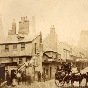 No date with this photograph. The sign on the corner of the building above the two men at centre reads Cow Gate to the left, unfortunately the name of the street leading up the bank is not legible.
Photograph from Stafford Linsley