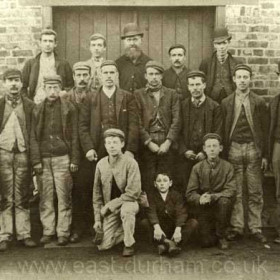 Tradesmen outside of old workshops. Probably fitters c 1895