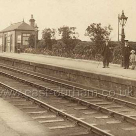 East-bound platform and Signal Box at Seaton Station c 1920? Waiting room at right, near station-master and family.