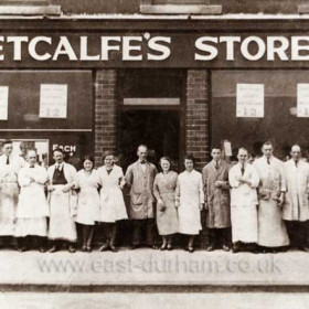 Metcalf's Stores in North Terrace in 1935. Left to Right; ?, Jack Alcorn, Sid Richardson, Mr McCartney, George Chambers, Peggy Wood, ?, Mr Metcalfe, Lily Myton, Molly Taylor, ?, Danny Brown, Albert Ramsay, Jack Turnbull, ?, Ted Purvis (manager).  The store was taken over by "Sungold" and moved to Station Rd after WW2, early 1950s? but closed in the early 60s.