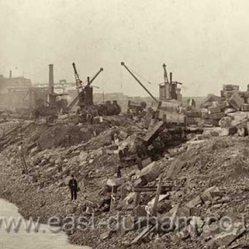 Detail from previous photograph showing wreckage, policeman in foreground.