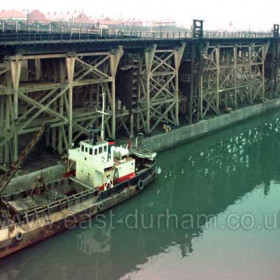 Staiths at SE corner of South Dock, dredger Coquet Mouth in foreground.  1980