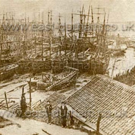 Detail from previous photograph, a dry South Dock, note bucket dredger at centre and paddle tug a little to the right.