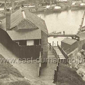 At the time of this photograph the building in the foreground was Seaham's Isolation Hospital, formerly Robert Potts' shipbuilding yard at SW corner of old south dock. a patent slipway was used at this yard. This yard originally belonged to William Henzell from 1834 until the 1850s probably primarily a ship repair yard he certainly built the"William" here in 1839 maybe more but I have no record of any other shipbuilding until Robert Potts built the "Caspian", the "Jane Duncan" and the "Robert and Mary" in the 1860s, all wooden sailing ships, with the advent of iron ships he turned to ship repair until after a fire in 1880 he ceased trading. A room in this building was used to isolate any sailors taken ill with suspected typhoid, cholera or smallpox even after 1894 when the Isolation Hospital was built. Known as the Quarantine Station it was still in use for this purpose in 1932. 
A view of this shipyard can be seen on SEAHAM MODEL 1864 section 10.