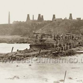 Derelict central pier in old south dock photographed on 16/6/1900.
Candlish Bottleworks on cliff-top.