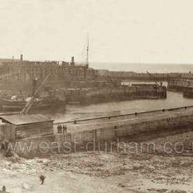 Old South Dock before 1900 in the background is the tug Lady Helen against central pier.