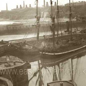 Looking south from the South Dock gates across the central pier to the tidal dock, South Pier, Chemical Beach, Bottleworks and Pilot Terrace at top right.Photograph early 1890s, not before 1891 as the gas process chimneys are visible at the Bottleworks.