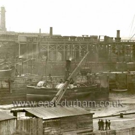 Old South Dock before 1900 with the tug Lady Helen in the dry side of the dock against the central pier.
The condition of the central pier is good here, this photograph could be quite early, do you know when the "Lady Helen" was working at Seaham?