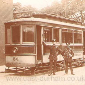 The crew of tram 54 stand proudly alongside at the Villette Road terminus in the summer of 1906. The stone wall on the right is on the opposite side of Ryhope Road, which crosses from left to right, much narrower than it is today. Tram 54 was withdrawn in 1931 and became a changing room on Spark's Farm playing field.    Caption from Malcolm Fraser.