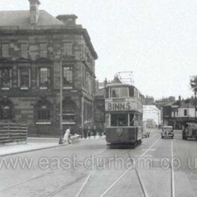 Sunderland tram 32 was one of eight cars bought from Huddersfield in 1938 and is seen here reversing in Borough Road before setting out for Fulwell in 1951. The tram lines beyond the car used to serve the Villette Road route until it closed in November 1950.  On the left, wooden railings still surround the bombsite that was Binns store on the corner of John Street, where a Corporation Daimler bus waits next to the offices of the Sunderland & South Shields Water Company.  Photo by R W A Jones, caption by Malcolm Fraser.