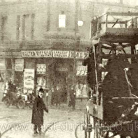 This frame from a 1903 movie of Sunderland town centre shows the SCT tower wagon galloping past the lighthouse building at the Wheatsheaf.
This movie is available from Norman Kirtlan on a DVD of Sunderland photographs, see the Links Page