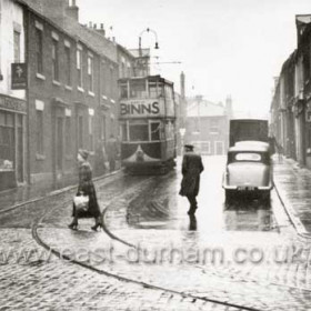 It is Friday 30th October 1953 and it is raining in Derwent Street as tram 63 makes its way towards Stockton Road as it works the Circle route. The outward bound service originally ran through Vine Place but this was too narrow for two tracks so the track was diverted through Derwent St and Mary St before rejoining the main route at the Star Hotel in New Durham Road. Information from Len Charlton and Malcolm Fraser.