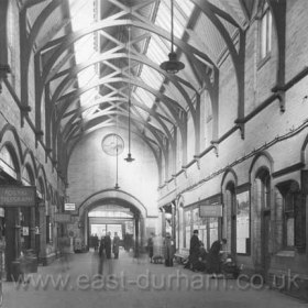 Sunderland Station on 16/10/1962. The end opening leads through the main station buiilding to the square doors which open to the covered taxi area outside. The two ramps to the platforms are behind the camera. When built in 1879 this North End of the station was an impressive structure but it was also a goods entrance and by the 30's it was badly run down and the arcade shown had many slot machines. In 1965 the main building and spire were demolished to make way for Littlewoods (then) on High St. Over the following years all traces of the Victorian station have disappeared into a completely different undergound layout.
Information from Len Charlton.