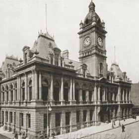 Fawcett Street has never been the same since they demolished the Sunderland Town Hall in 1971. It was built in 1890 and this view of the much-loved building was taken before 1900. On the left can be seen the south entrance to the Central Station, built by the North Eastern Railway in 1850. On the right is the Singer Sewing Machine Company shop on the corner of Athenaeum Street. The open space beyond the town hall was filled by a ‘temporary’ wooden building used as offices for the new electric tramway from 1900 till 1906. It was later used as the library reading rooms and lasted until the town hall was demolished.     Info from Malcolm Fraser