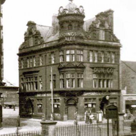 After a major rebuild the Dun Cow became a large very popular pub sited facing  the Empire Theatre (the entrance canopy and sign are on the left edge of photo ).  The railings are in Bishopwearmouth church grounds.      Photograph N Kirtlan, caption Len Charlton.