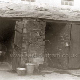 ' Netty ', communal tap and coalhouse in yard behind Hunter's Buildings c 1930. This toilet might not look too inviting but it was a great improvement on the earlier, dry, ash-pit netties.