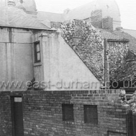 Rear of Green St. opposite the Theatre Royal c 1950.Rear of Matson's shop at left. Roof of the Theatre Royal (Gaff) can be seen at top of frame.