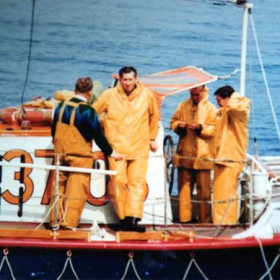 Bob Williams facing the camera  with Harry Sayers, Ray Riddell, and Arthur Farrington, who was the Coxswain at that time on the "Will and Fanny Kirby"
Photograph and caption from Bob Williams