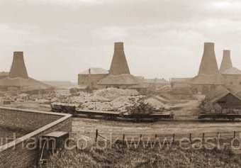 John Candlish opened his bottleworks in 1853 and absorbed the nearby Fenwick's Bottleworks in 1856. When he died in 1874 his factory consisted of seven bottlehouses. In this photograph the seventh ( close to Gallery Row at right ) has not yet been built
Photograph 1870.
Prior to these bottleworks there was a small glassworks in the yard of The Canterbury in North Railway St