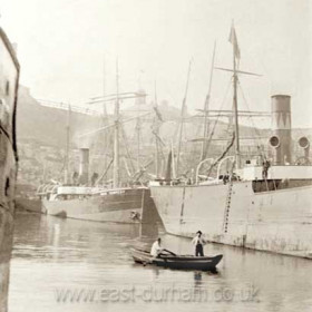 Pilot cobble in north dock c 1903, Londonderry steamer "Vane Tempest" in background. Londonderry Offices in North Terrace above.