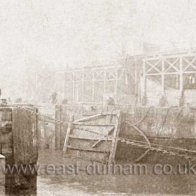 Removal of dock gate prior to replacement during a major refurbishment and enlargement of the dock in 1888.